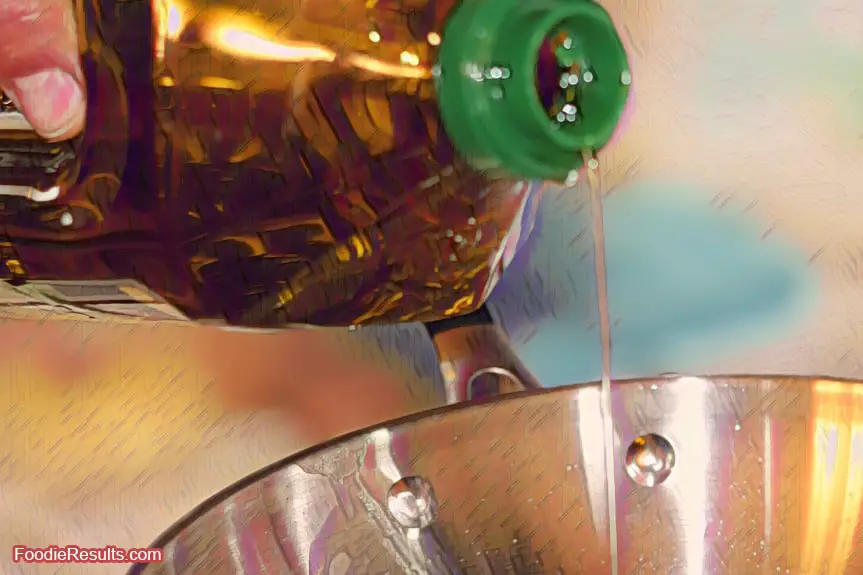 Cooking oil pouring out of bottle