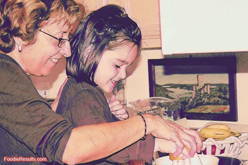 Grandma helping grandkid cook